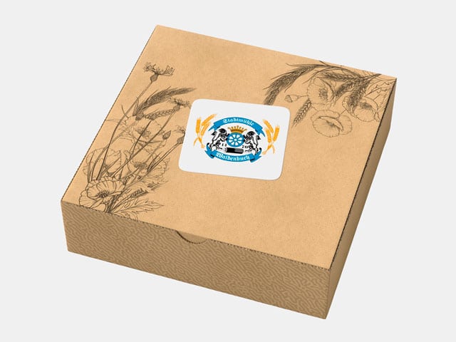 Hübsche Überraschungsbox mit Stadtmühle Waldenbuch Aufkleber und Blümenornamenten